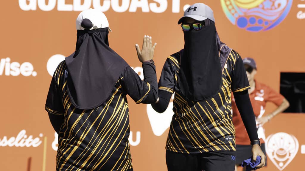 Two bowlers high five