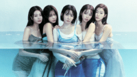 LE SSERAFIM posing for a photo, half submerged in water