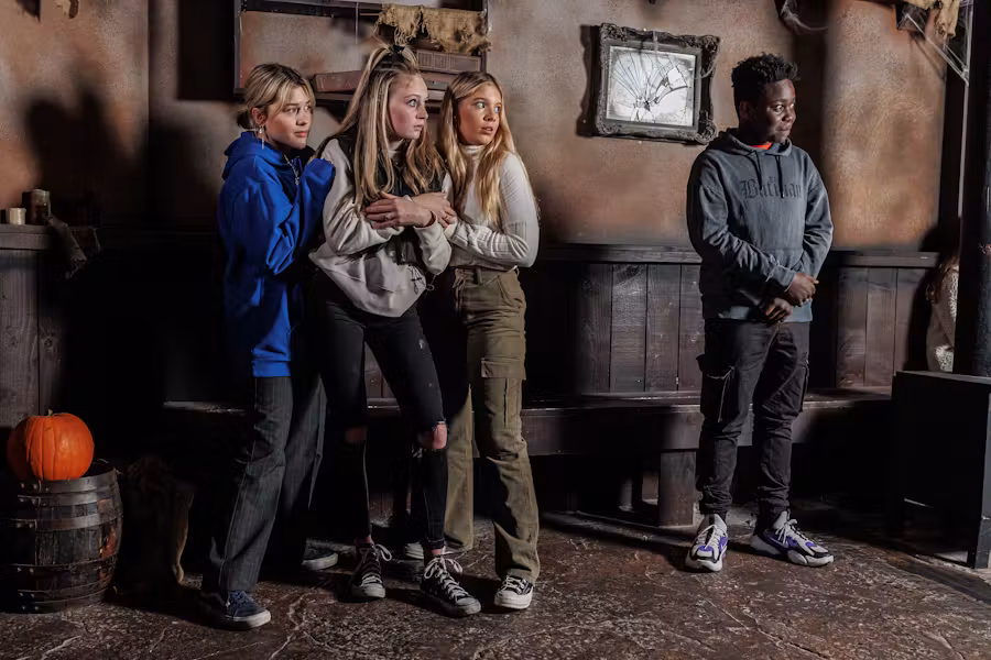 A group of children look frightened in The London Dungeon