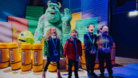 Four children scream at the Monsters Inc room in the Mundo Pixar Experience, London