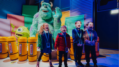 Four children scream at the Monsters Inc room in the Mundo Pixar Experience, London