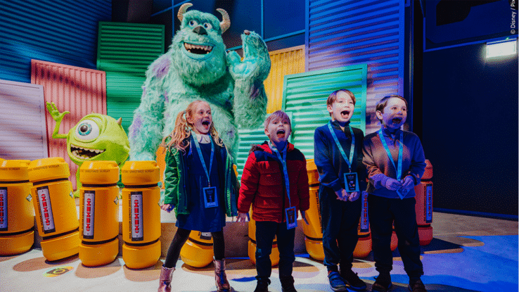 Four children scream at the Monsters Inc room in the Mundo Pixar Experience, London