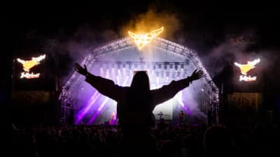 A silhouette of the crowd cheering at Belladrum Tartan Heart Festival