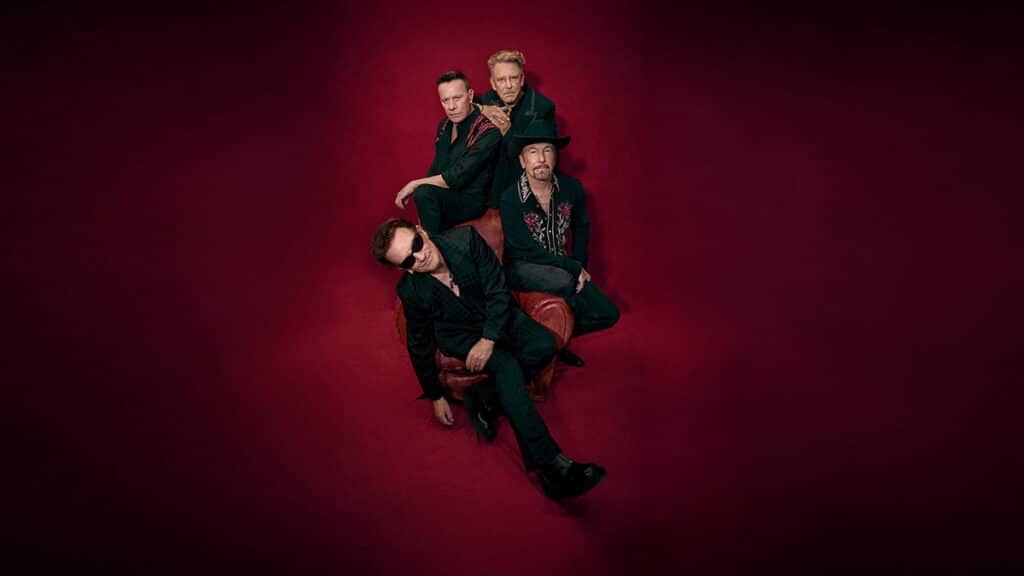 U2, the band, all sit on the same armchair
