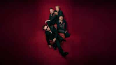 U2, the band, all sit on the same armchair